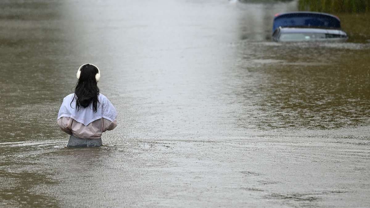 Two ADF trucks rolled over in flood-affected NSW, injuring 13 people.